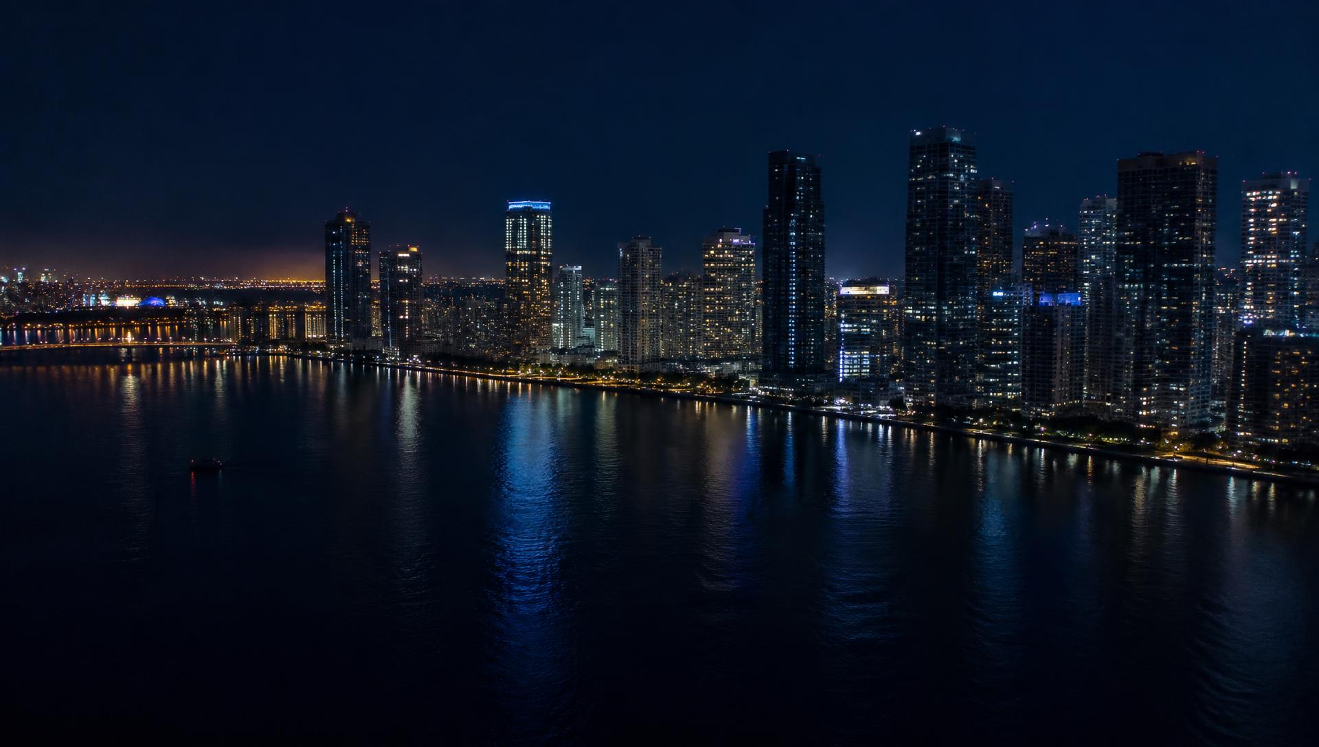 Aerial view of the Miami River waterfront and the Brickell skyline at night